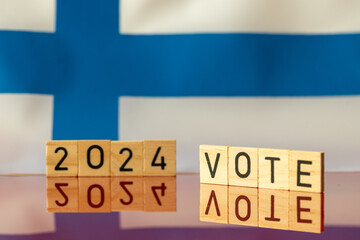 2024 elections in Finland, Finnish national colors and the inscription VOTE 2024 Concept of presidential elections in Finland in 2024 - obrazy, fototapety, plakaty