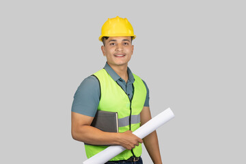 An Asian Happy Construction Worker Engineer giving expression gestures with chartpaper and notebook