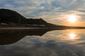 Reflection in river, The reflection of the mountain,  forest, sun, sky blue and  clouds on surface of stagnant river in Jijel Algeria Africa, Reflection in lake sunset, Calm nature concept. Pond.