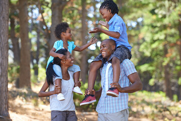 Happy, laughing or black family hiking in forest to relax or bond on holiday together in nature. Funny children siblings, mother or African father in woods trekking on outdoor adventure with smile - obrazy, fototapety, plakaty