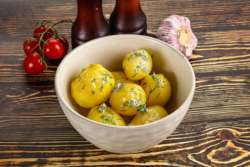 Boiled potato with oil and dill