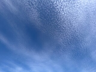 Natural sky Background. Embrace the Serenity of a Sky Filled with Fluffy Altocumulus Clouds Dancing in the Azure Expanse