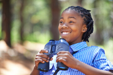 Binocular, search or happy boy child in forest hiking, sightseeing or discovery. Lens, equipment or excited African kid in nature for adventure, learning or seeing, explore or watching while camping