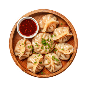 Dumpling momos with sauce in a wooden plate isolated on transparent background Remove png, Clipping Path, pen tool
