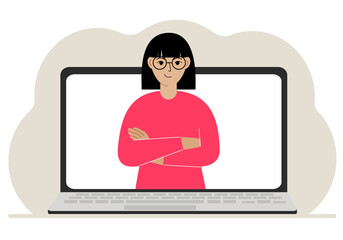 Woman communicates via videoconference through laptop screen. The concept of online meetings, webinars, remote work or work from home.