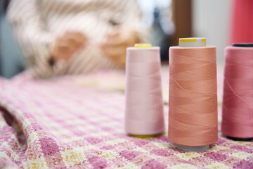Craftswoman in a workshop works at a cutting table