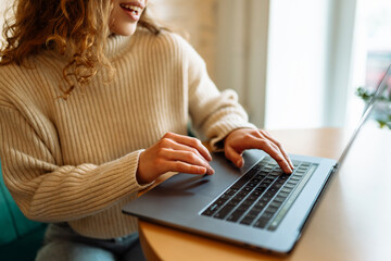 Close-up of hands working on a laptop keyboard. Freelance, online course. Technology.  Cyber security concept