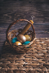 Still life Easter eggs and Easter cake on the table in Ukrainian style. The concept of home comfort in the bright holiday of Easter.