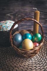 Still life Easter eggs and Easter cake on the table. The concept of home comfort in the bright holiday of Easter.