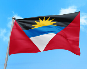 Antigua and Barbuda flag fluttering in the wind on sky.