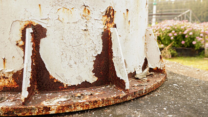 Rust of white painted metal tank wall. Rusty metal background with streaks of rust. Rust stains....