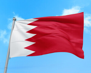Bahrain flag fluttering in the wind on sky.
