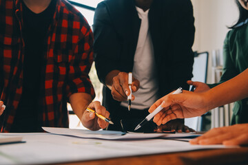 Male mature caucasian ceo businessman leader with diverse coworkers team, executive managers group at meeting. Multicultural professional businesspeople working together on research plan in boardroom.