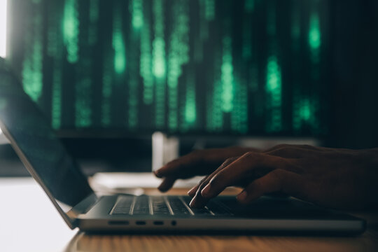 Hacker code in laptop. Cyber security, privacy or hack threat. Coder or programmer writing virus software, malware, internet attack or developing digital design. Green web data in computer screen.