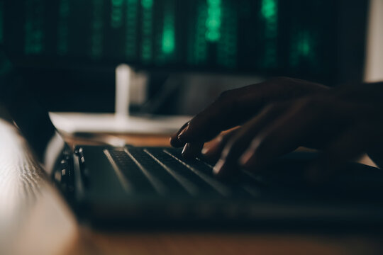 Hacker code in laptop. Cyber security, privacy or hack threat. Coder or programmer writing virus software, malware, internet attack or developing digital design. Green web data in computer screen.