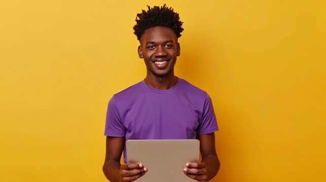 Full body young man of African American ethnicity he wears purple t-shirt casual clothes hold use work on laptop pc computer do winner gesture isolated on plain yellow background. Lifestyle concept.