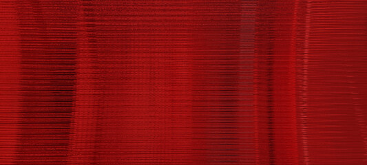 dark red glass sheet wall or corrugated wall pattern texture use as background. frosted wave glass in horizontal line pattern in the translucent and polished effect.