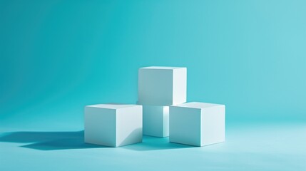 Obraz premium Three white cubes on a blue background.