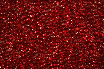 Abstract background from red beads close-up.