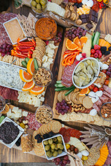 Table top charcuterie appetizers on wooden trays.