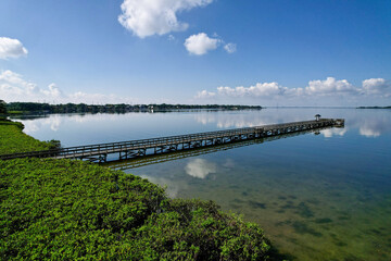 Fototapeta na wymiar An aerial drone view of the fishing pier at R.E. Oldmars Park in Florida.