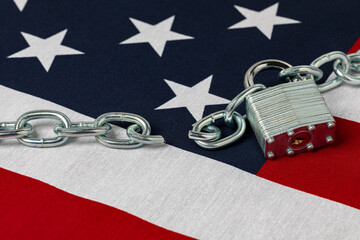 United States flag with lock and broken chain. Border security, immigration reform and illegal...