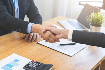 Support, business people, happy asian young man in suit, making handshake, shake hand together with...