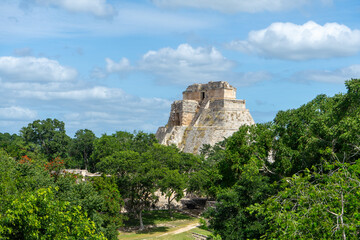 Fototapeta na wymiar Pyramid of the Magician, Maya Temple in middle of forest, Uxmal, Mexico