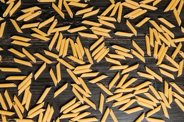 raw pasta is scattered on the table