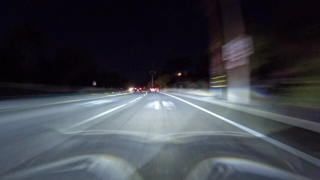 Night driving time lapse view on Erbes Road, Route 23 freeway and Olsen Road in the Thousand Oaks area of Ventura County, California.