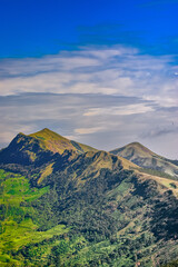Get lost in the breathtaking beauty of nature with this stunning view of a majestic mountain range.