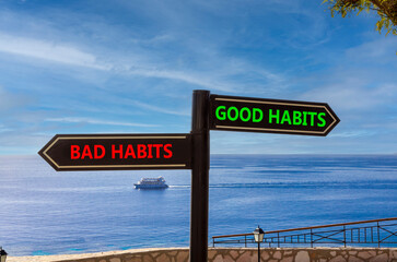 Good or bad habits symbol. Concept word Good habits Bad habits on beautiful signpost with two...