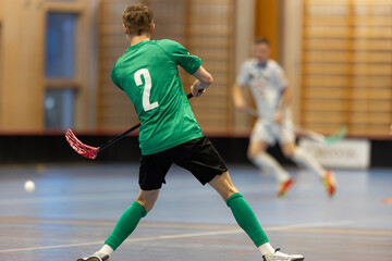 Floorball players playing in a floorball championship game