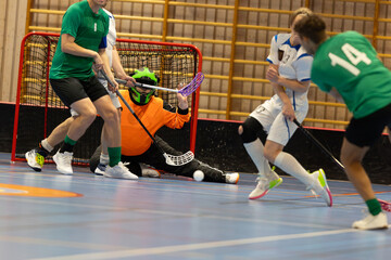 Floorball players playing in a floorball championship game