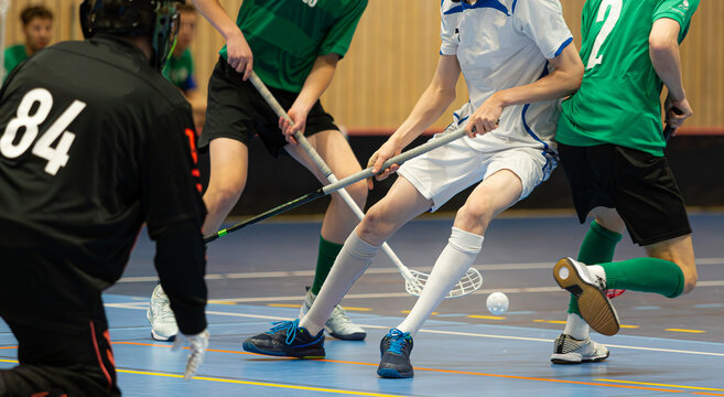 Floorball players playing in a floorball championship game