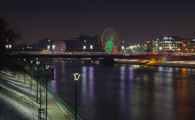 night view of the bridge and ferris wheel
