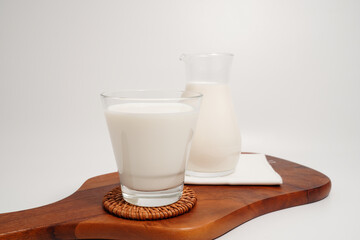Fresh milk drink in a clear glass, white background