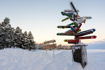 snow covered signpost