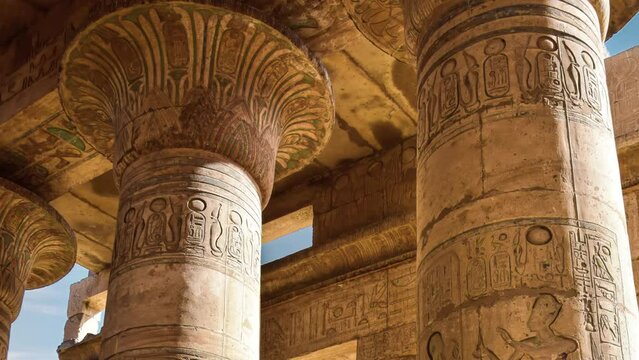 Karnak temple complex in Luxor Egypt. Central columns of Hypostyle Hall with hieroglyphs.