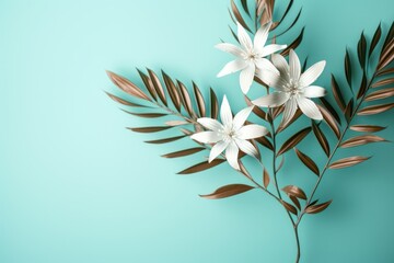Fototapeta na wymiar Artistic arrangement of white flowers and bronze leaves on a turquoise background, a blend of nature and design.
