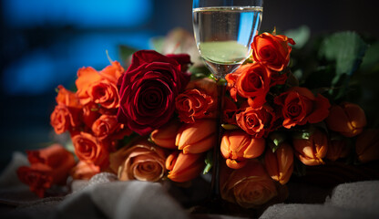 Big bouquet in red with roses and champagne for feelings of love. Romantic background for valentins...