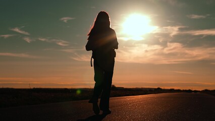 girl traveling with backpack sunset, family sun, hiking girl asphalt road, legs teenage tourist walking through forest park, back view woman traveling on an autumn road with backpack, teenage girl