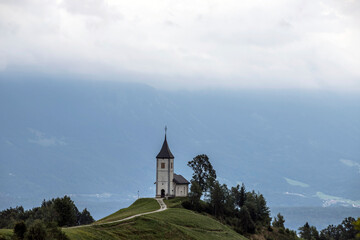 Jamnik, Slovenia - Magical foggy summer day at Jamnik St.Primoz church.