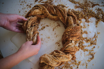 Preparing cruffin with nuts. Baking kraffin. Cook big cinnamon cruffin. Cinnamon bun. Cinnamon roll. Sweet dough.