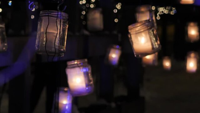 The nature park is decorated with lanterns in the dark. Video clips.