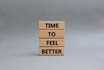 Time to feel better symbol. Wooden blocks with words Time to feel better. Beautiful grey background. Medicine and Time to feel better concept. Copy space.