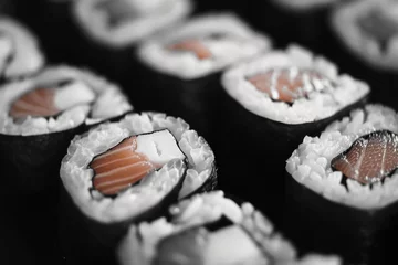 Fotobehang A monochrome image showcasing sushi rolls. Perfect for food blogs, restaurant menus, or culinary websites © Fotograf