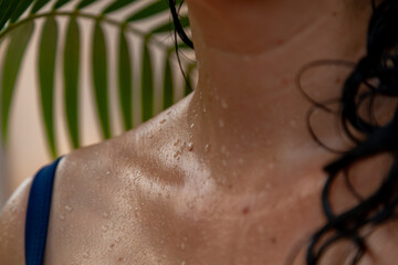 Fototapeta premium Water drops on wet body of woman in swimsuit....