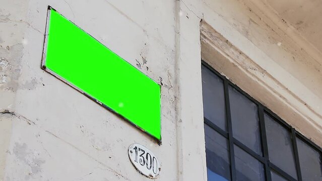 A Street Sign Green Screen with Flying Particles in Buenos Aires, Argentina. Close Up.