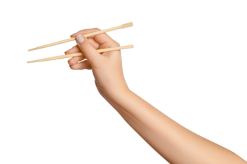 A woman's hand holds wooden chopsticks for sushi or rolls on a blank background.